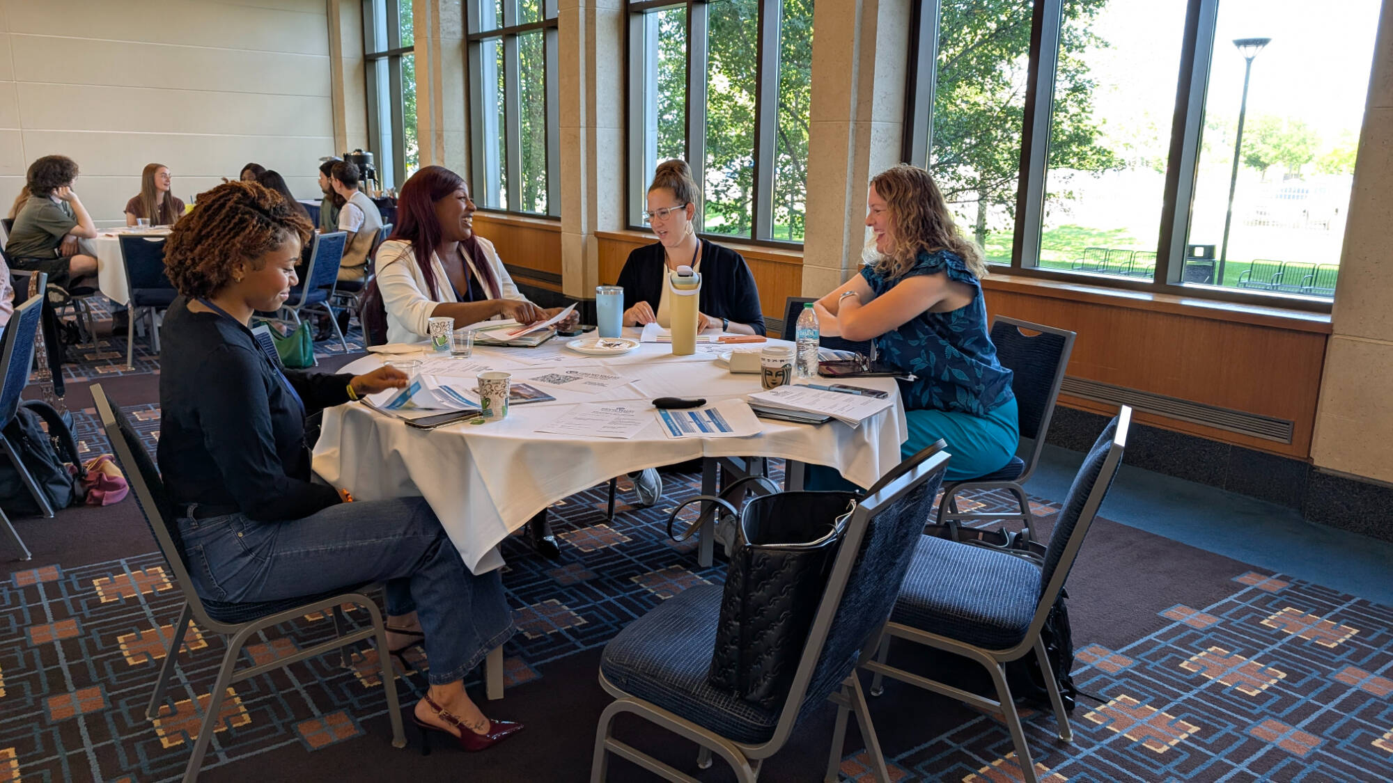 Attendees at the Social Work Convening participate in a small-group discussion.